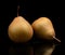 Two pair pears called manon isolated on black