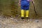 Two pairs of color children`s gumboots standing children