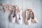 Two pairs of pointe shoe on the wooden floor