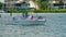 Two pairs of senior citizens walk on a boat