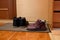 Two pairs of shoes on a door mat. Shoes in the hallway. Home comfort.