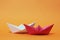 Two paper boats, competition