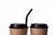 Two paper takeaway cup with black glass reusable straw and biodegradable lid