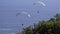 Two paragliders drift in the wind near Cape Town