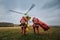 Two paramedic with safety harness running to helicopter emergency medical service