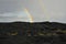 Two partial Rainbows and black lava