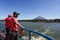 Two passengers stand at rail during Ferry ride to Ometepe Island in Lake Nicaragua.