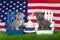Two patriotic kittens on lawn chairs with flag and a cupcake