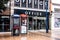 Two Pay Phone Public Telephone Boxes Outside A Closed Office Retail Store with No People