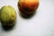 Two peaches on a marble background