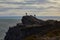 Two people climbing a cliff on Cape d\'Erquy in Brittany  France