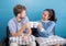 Two people couple in living room enjoy with drink coffee