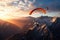 Two people enjoying the thrill of paragliding as they soar over a stunning mountain range at sunset, Paragliders flying over