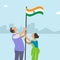 Two people hoisting the Indian flag on the occasion of Independence Day.