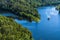 Two people on the largest double rope slide 120m above the abyss of the Rappbodetalsperre in the Harz Mountains in Germany