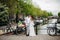 Two people in love stand on a bridge in Amsterdam .