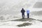 Two people, a man and a woman admire the winter landscape of the Norwegian mountains