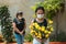 Two people mourning lost ones to coronavirus, wearing face masks