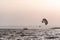 Two people parasailing on the sea