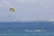 Two people parasailing in the sea at summer