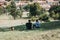 Two people sitting, enjoying the view of Prague from Petrin Hill, Czech Republic