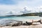 Two people sitting near the beach overlooking the sea and St Ives