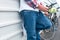 Two people standing with mobile phone in the handw, resting close the electric bicyles