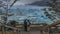 Two people are standing on the observation deck at the Perito Moreno glacier