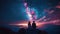 Two People Standing on Top of a Mountain Looking at the Stars