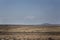 Two people turning turf in the vast landcape of county Mayo.