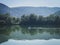 Two peoples kayaking on the coiselet lake, Jura