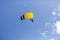 two-person parachute descent seen from below