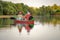 Two persons enjoying Danube Delta in a boat Canoe