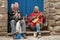 Two peruvian blind musicians playing flute and mandoline in the street of Cusco, Peru