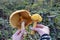 Two Phaeolepiota Aurea mushrooms in a child\'s hands