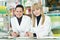 Two Pharmacy chemist women in drugstore