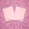 Two photo card on pink fabric background