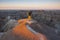 Two photographers photograph White River Valley Overlook at Badlands National Park during a sunrise