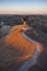 Two photographers photograph White River Valley Overlook at Badlands National Park during a sunrise