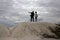 Two photographers are standing on a hill of the cretaceous plate