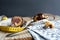 two pieces of bundt cake placed on a wooden table with a measuring tape around them and a fork with a stuck piece of cake