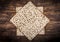 Two pieces of jewish passover matzah unleavened bread in form of Jewish Star of David Magen David on wooden table. Top view.