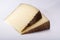 Two pieces of Manchego, queso manchego, cheese made in La Mancha region of Spain from the milk of sheep of the manchega breed, is