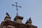 Two pigeons perched on a Chapel at Pigeon Park