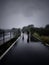 Two pilgrims walking in the rain