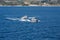 Two Pilot Boats Circling in Blue Water