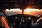 Two pilots in the cockpit of an airliner at sunset are a team of skilled professionals responsible for safely flying the