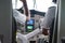 Two pilots in the cockpit of the sea plane get ready for a flight