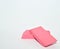 two pink erasers on a white background