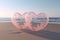 Two pink Heart-shaped transparent bubbles on the beach for wedding decoratio